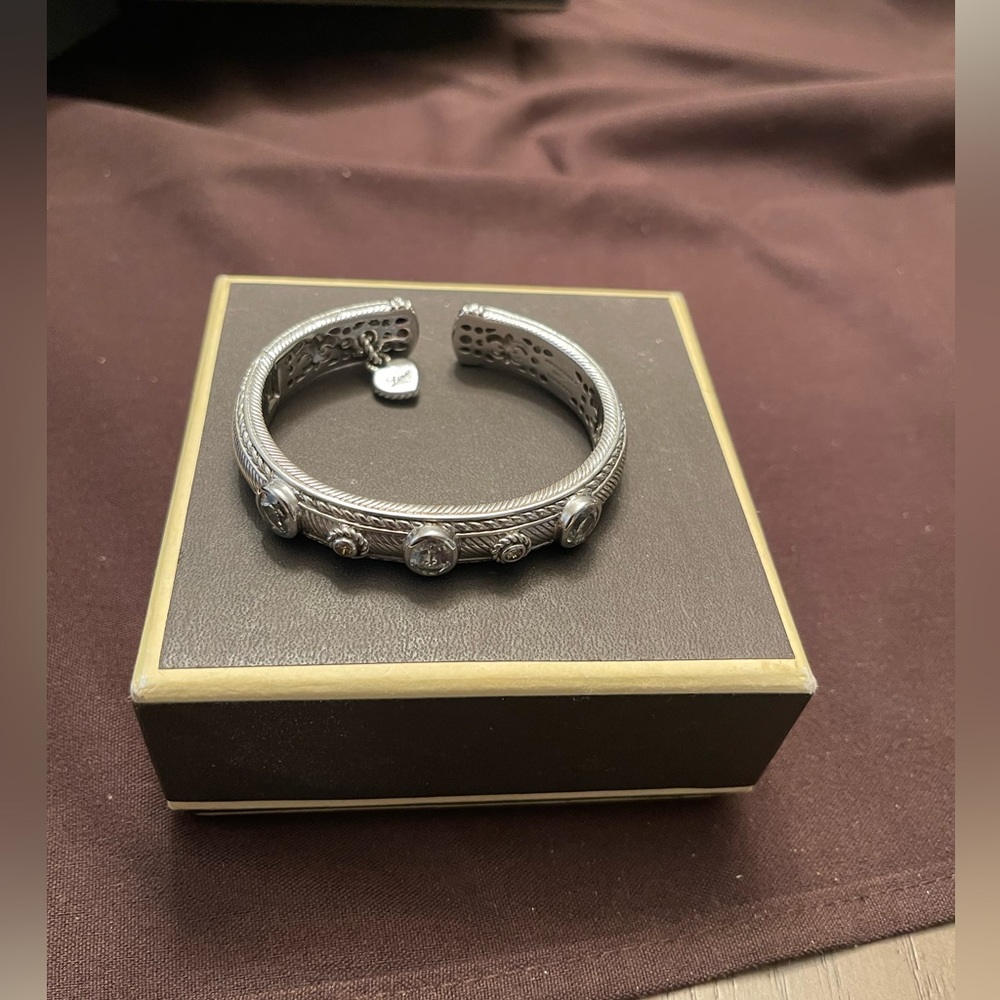 Judith Ripka silver bracelet with three oval green amethyst stones.